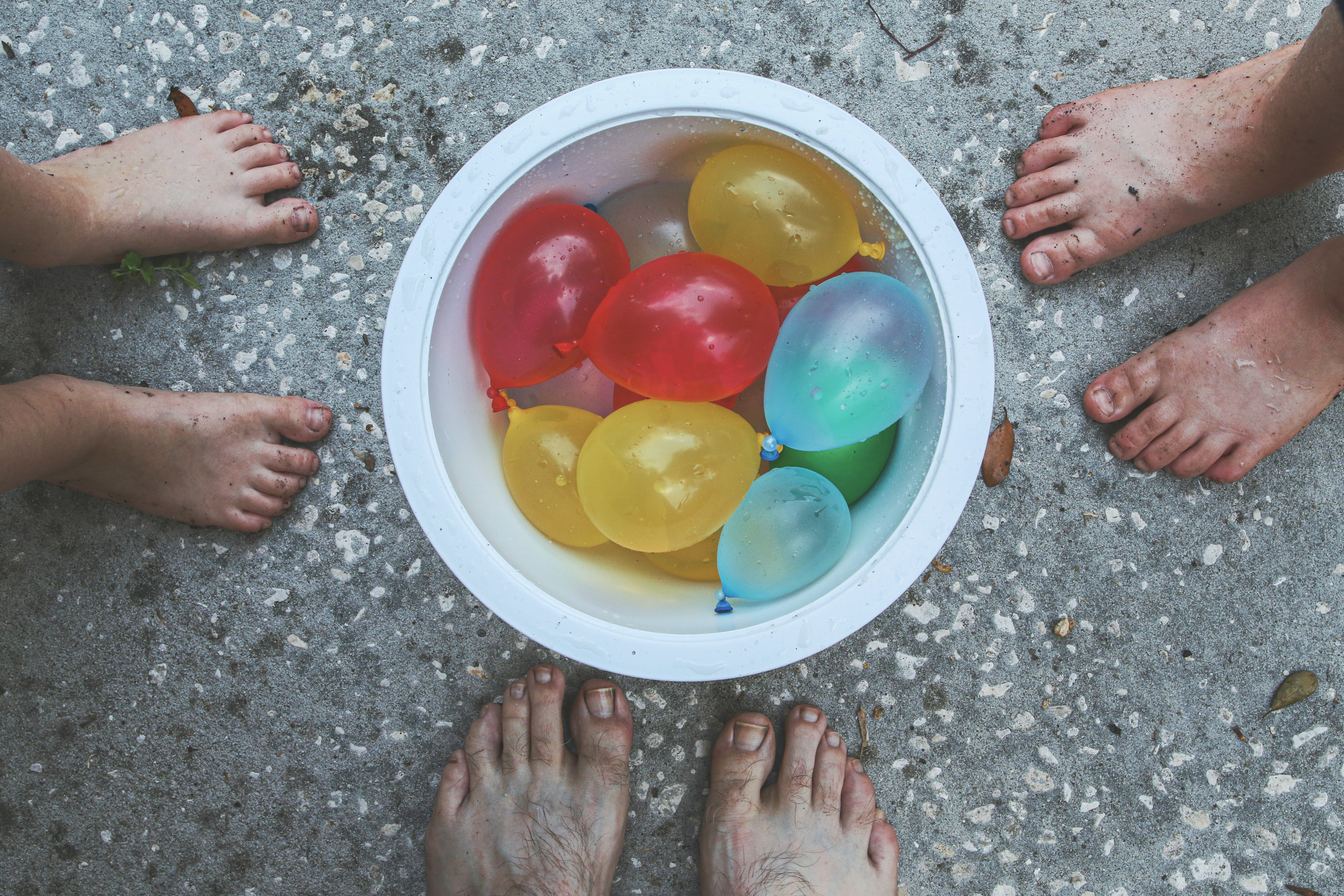 yellow red blue and green balloons on white round plate